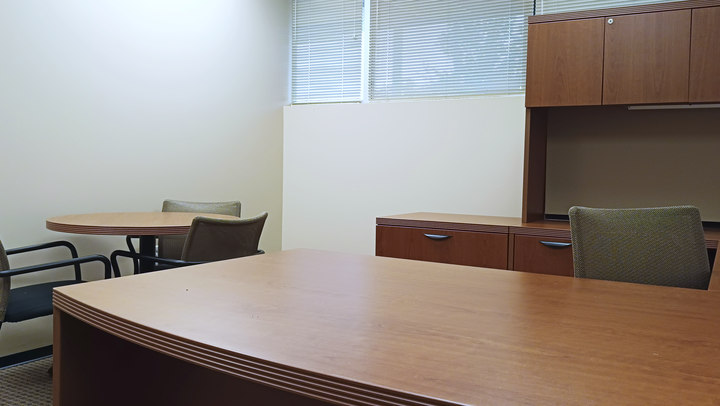 Office 6 reverse view showing the desk and round table