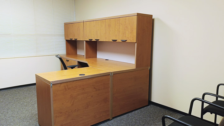Office 3 desk and cabinetry beside the window