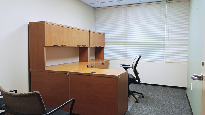 Office 2 desk and cabinetry viewed from the doorway
