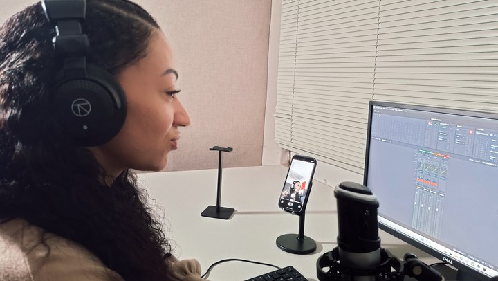 A closer side view of the microphone, monitor and phone camera preview in Podcast Room A