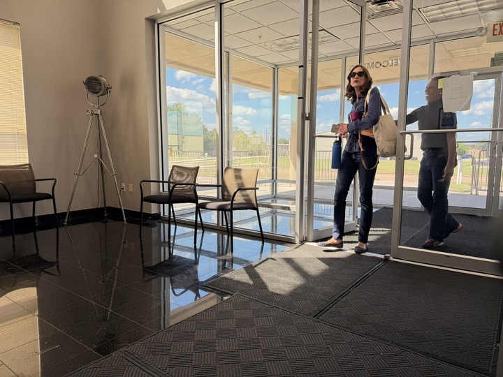 The glass entrance and seating area at Canis Lupus