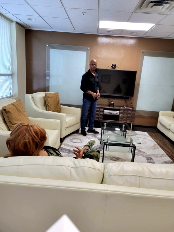 Visitors in a seating area at Canis Lupus Studios